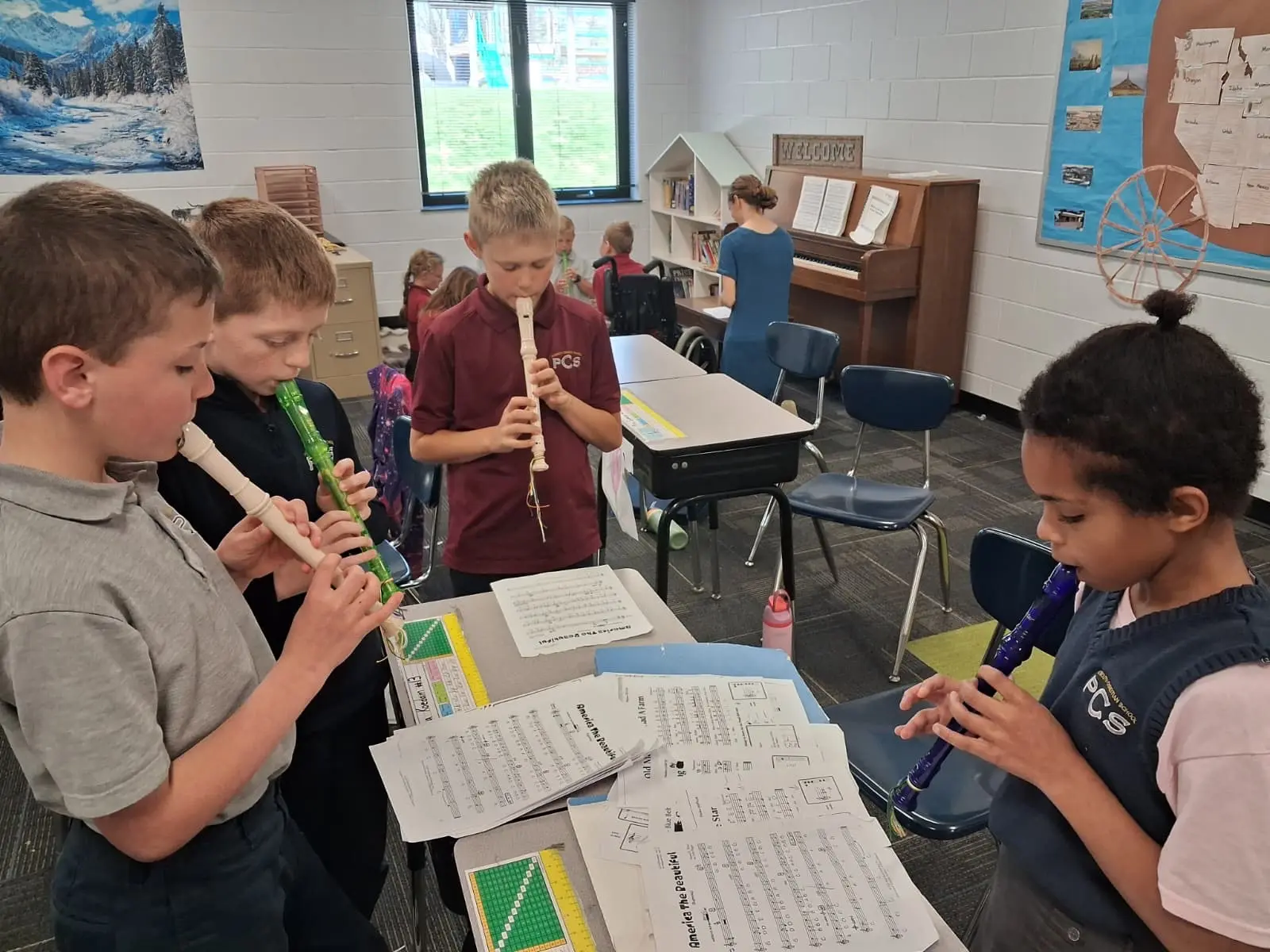 Students practicing their recorders in music class